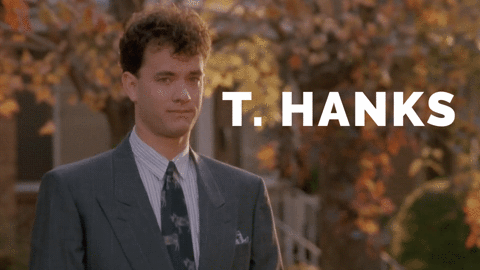 Tom Hanks waving, the words "T. Hanks" appear on the screen