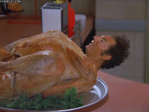 A turkey is sitting on a countertop, but it has Cosmo Kramer's head stuck to it... he turns and looks at us, gives us a nod, and raises his eyebrows at us.